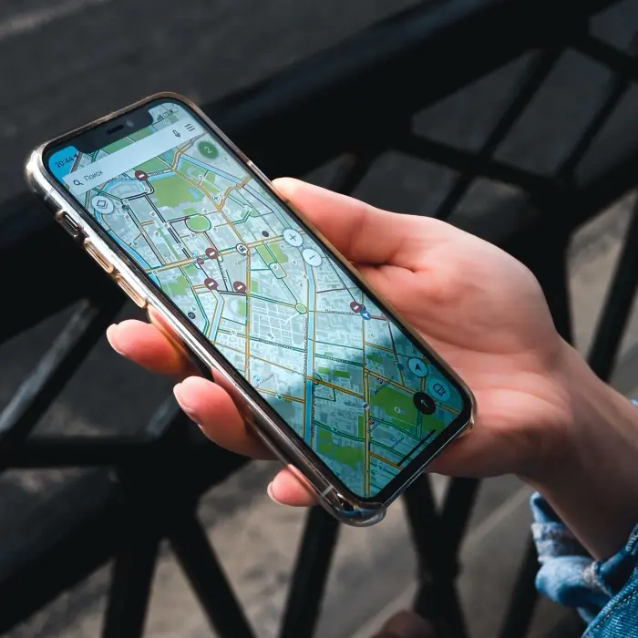 A phone showing a map of nearby businesses